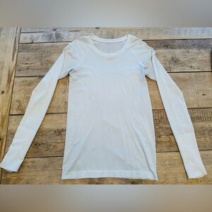 Lululemon Swiftly Tech Long Sleeve black shirt hip length Sz 6